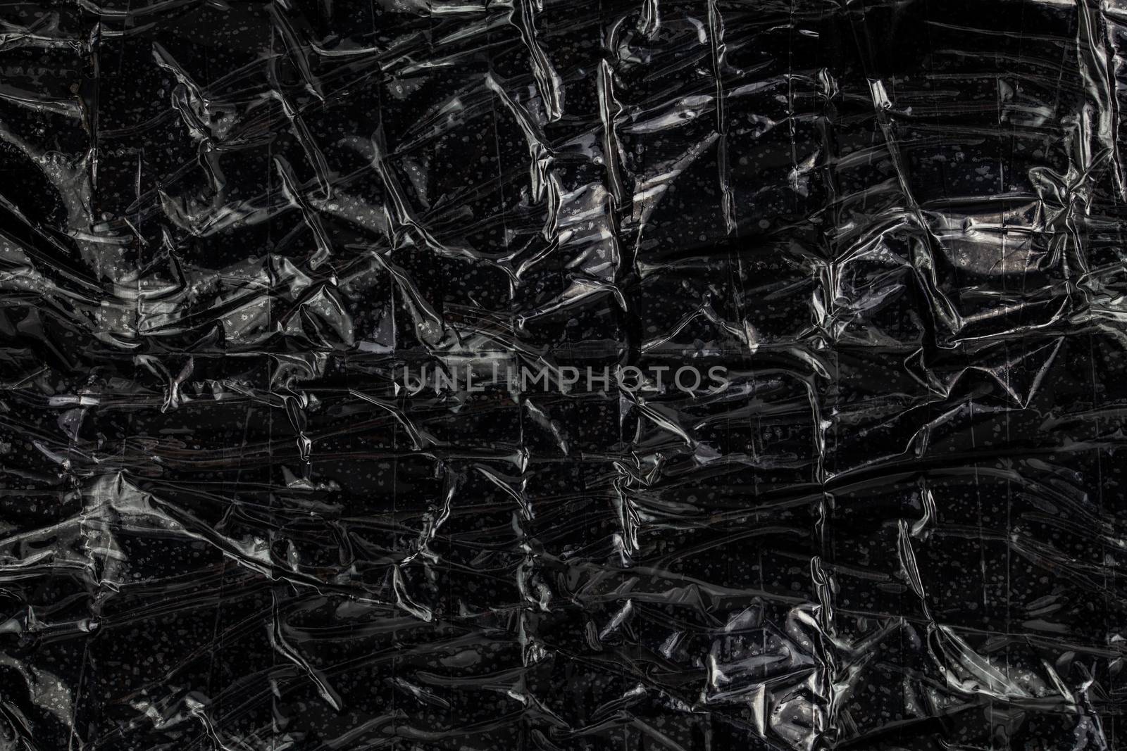 black polyethilene film enforced by sticky tape flat smuggle package texture and background