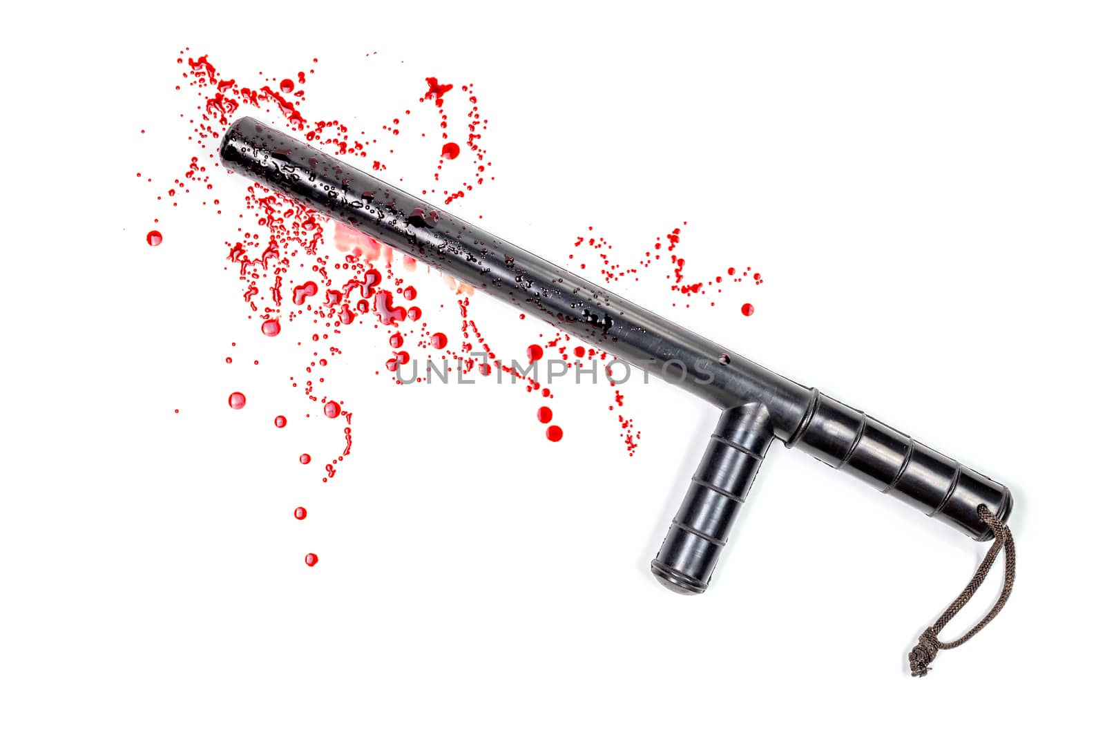 Bloody russian police rubber tonfa baton in blood spatter isolated on white background in top-down flat lay perspective. Natural human blood used.