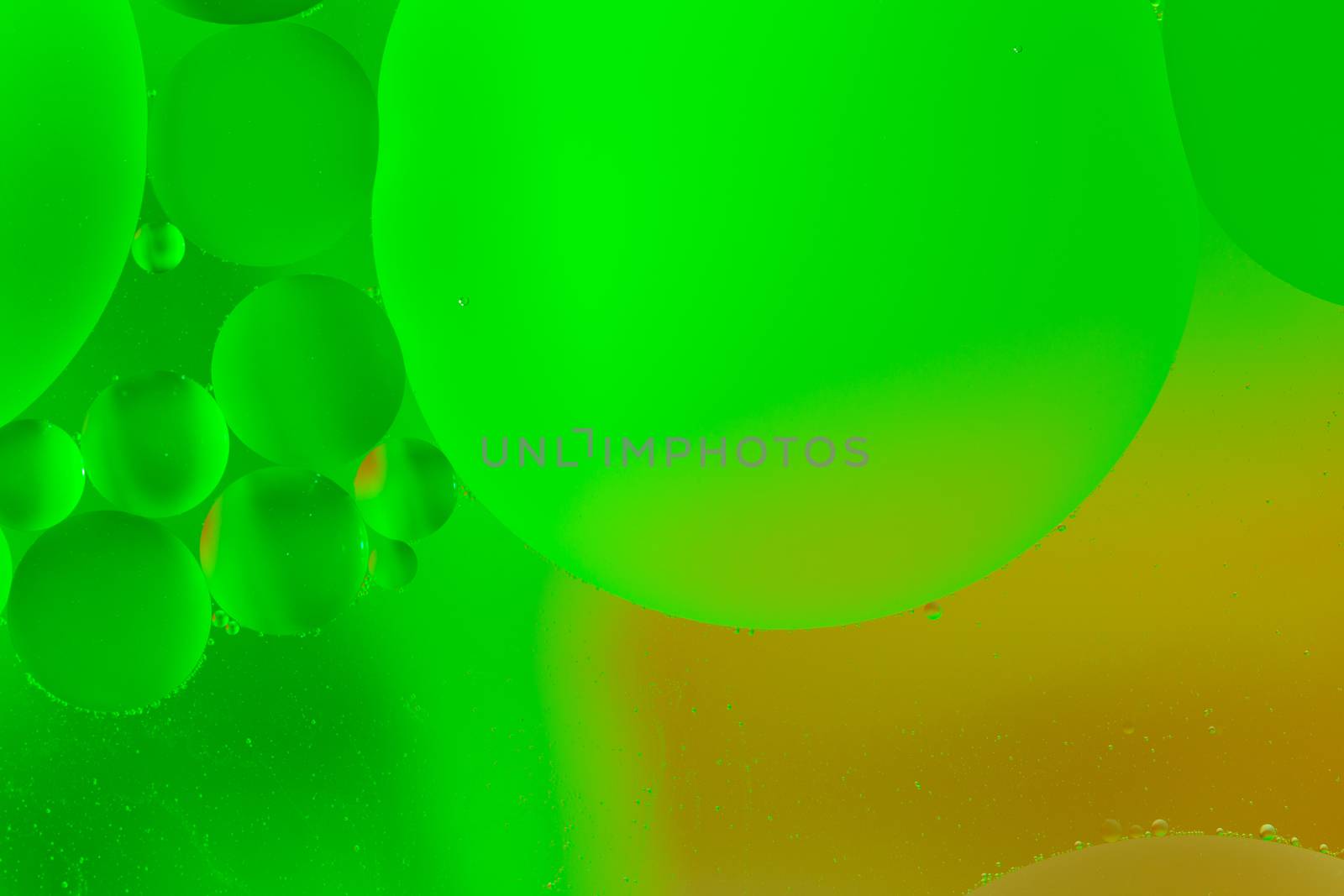 abstract acid ufo green oil in water macro artistic background
