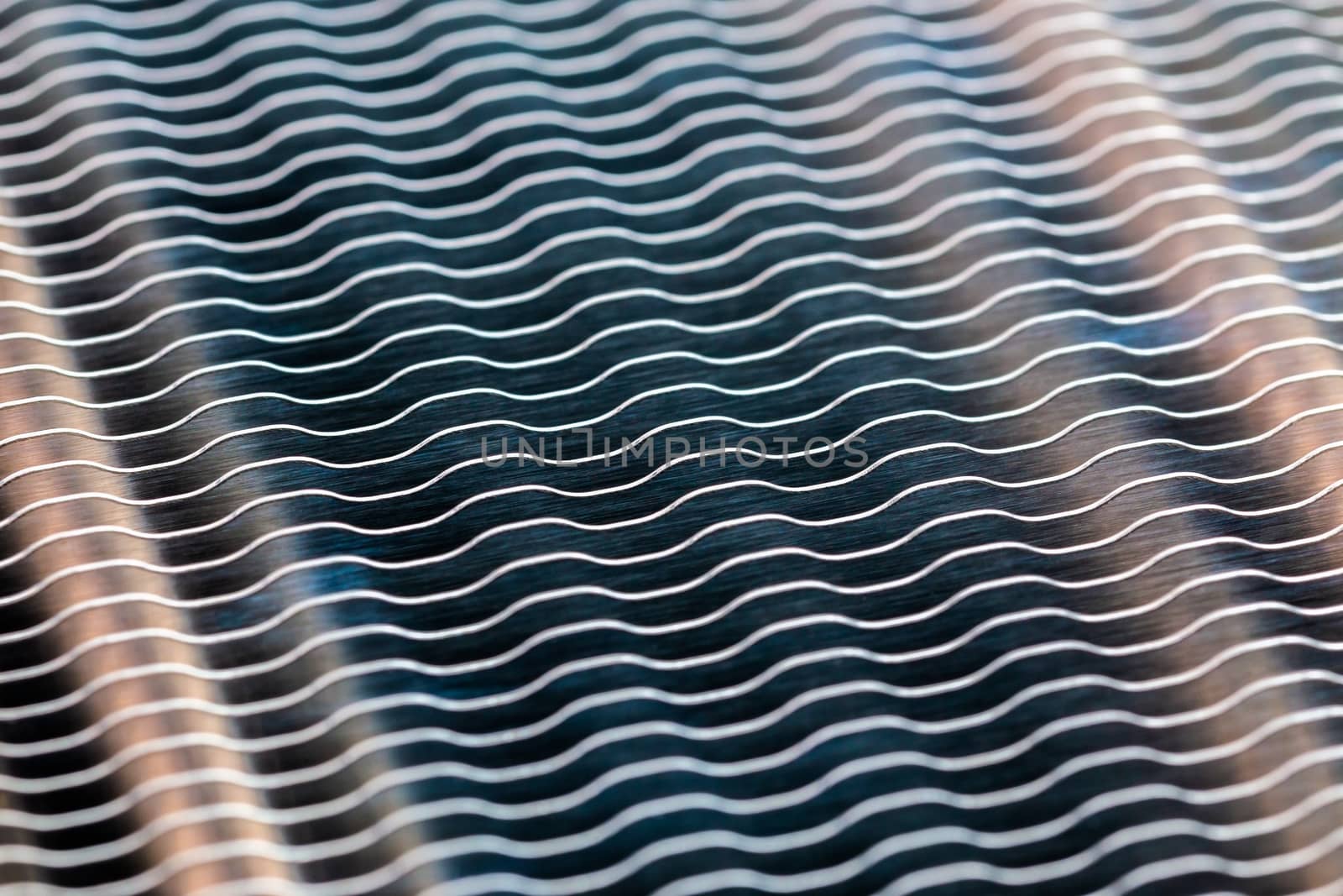 modern heat radiator closeup macro background with selective focus, blur and diagonal composition