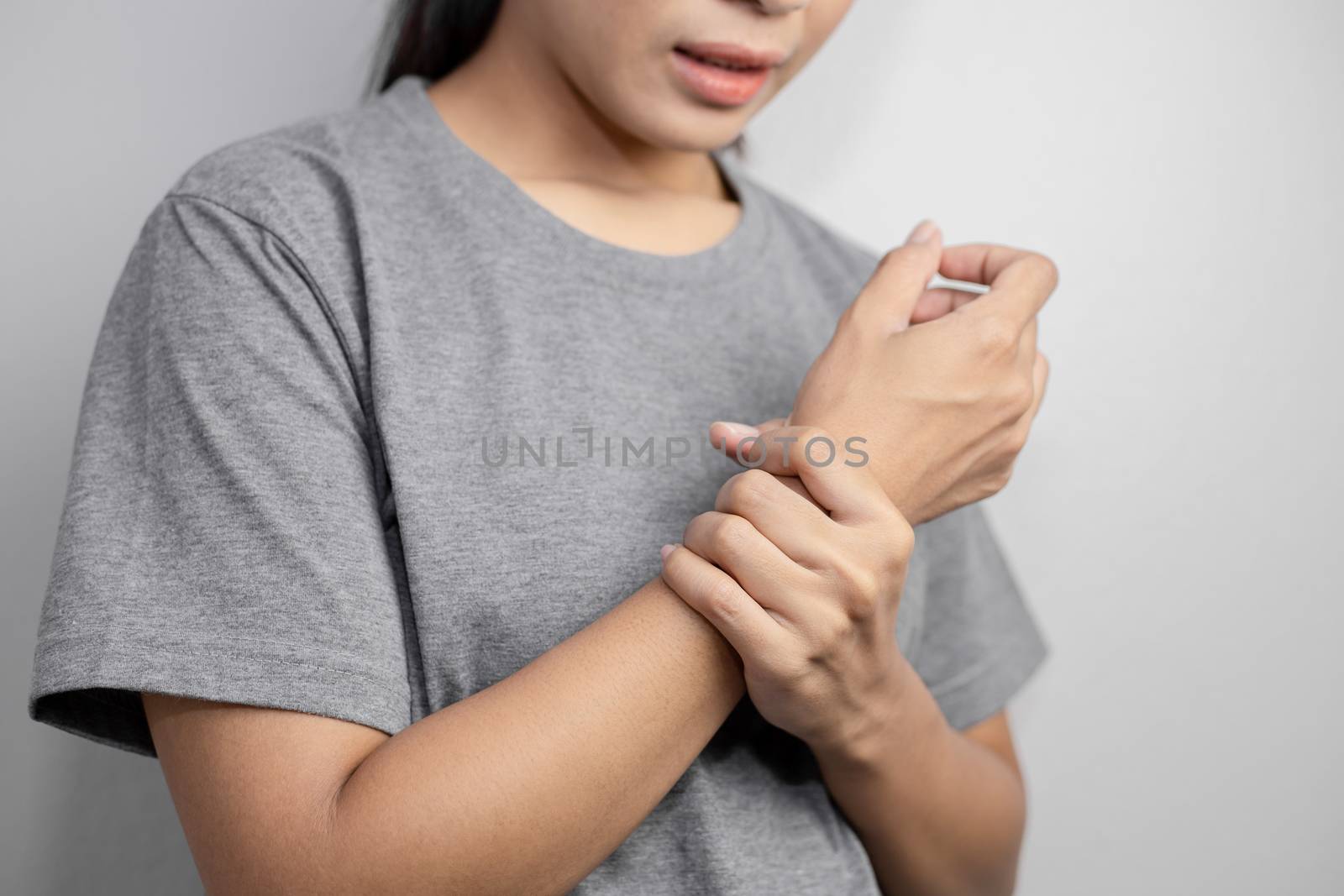 Woman suffering from pain in wrist. by pokpak05