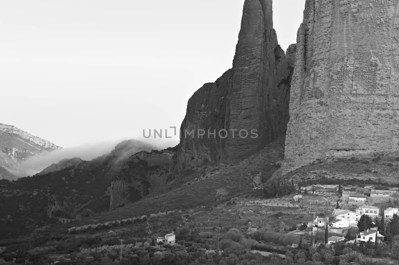 Deserted Spain in black and white. Spanish medieval village at the foot of the rocks in the Pereneus mountains