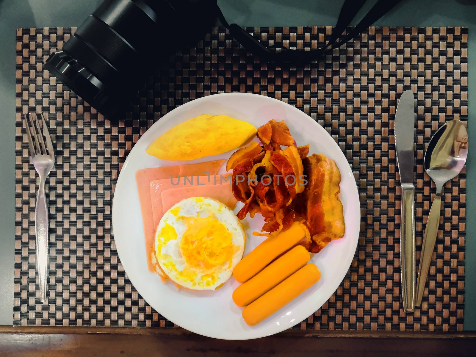 top view of breakfast on table with fork, spoon and camera