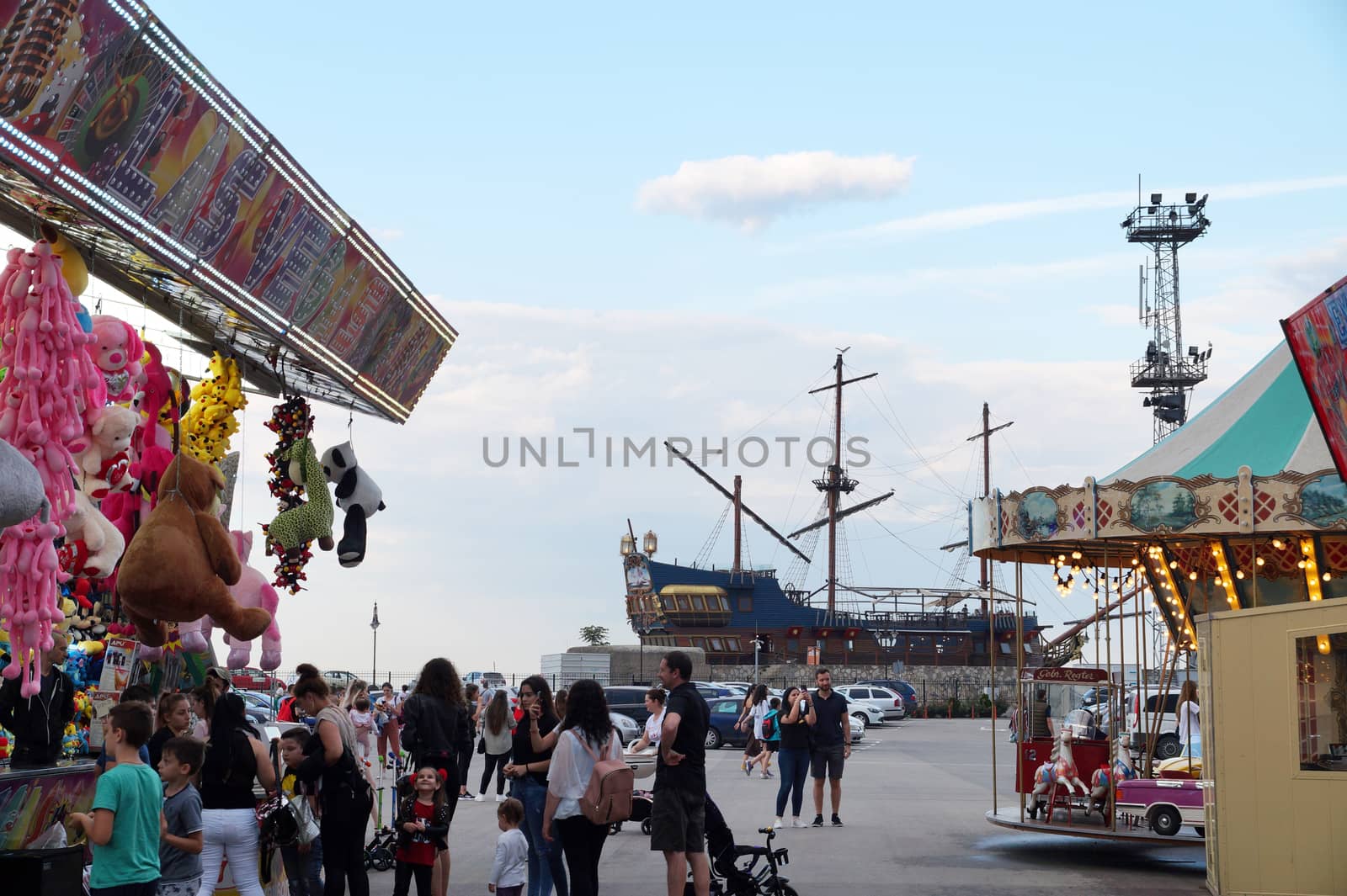 city amusement park with attractions in summer by Annado