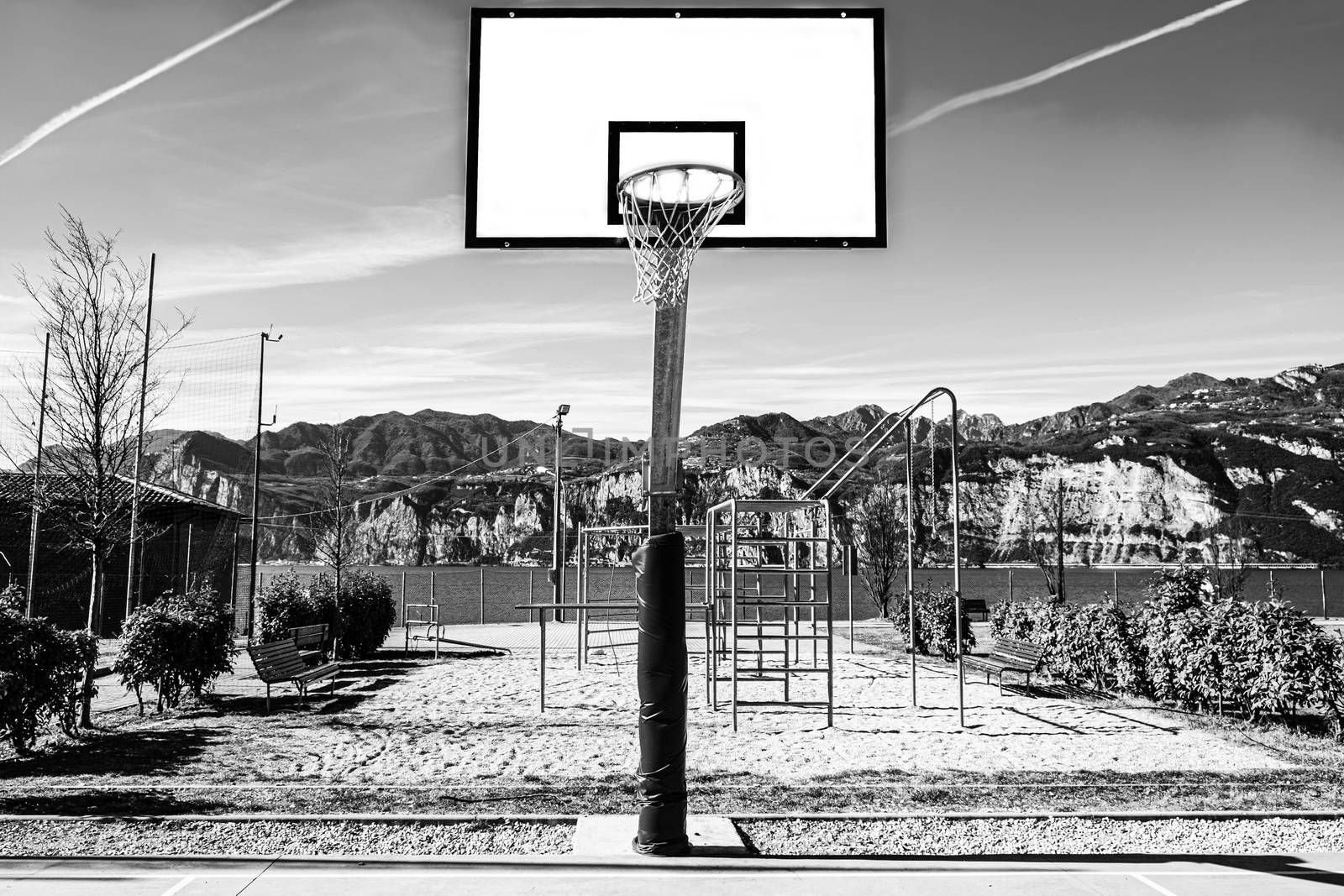 Deserted sports field on the shores of Lake Garda in Italy in black and white.
