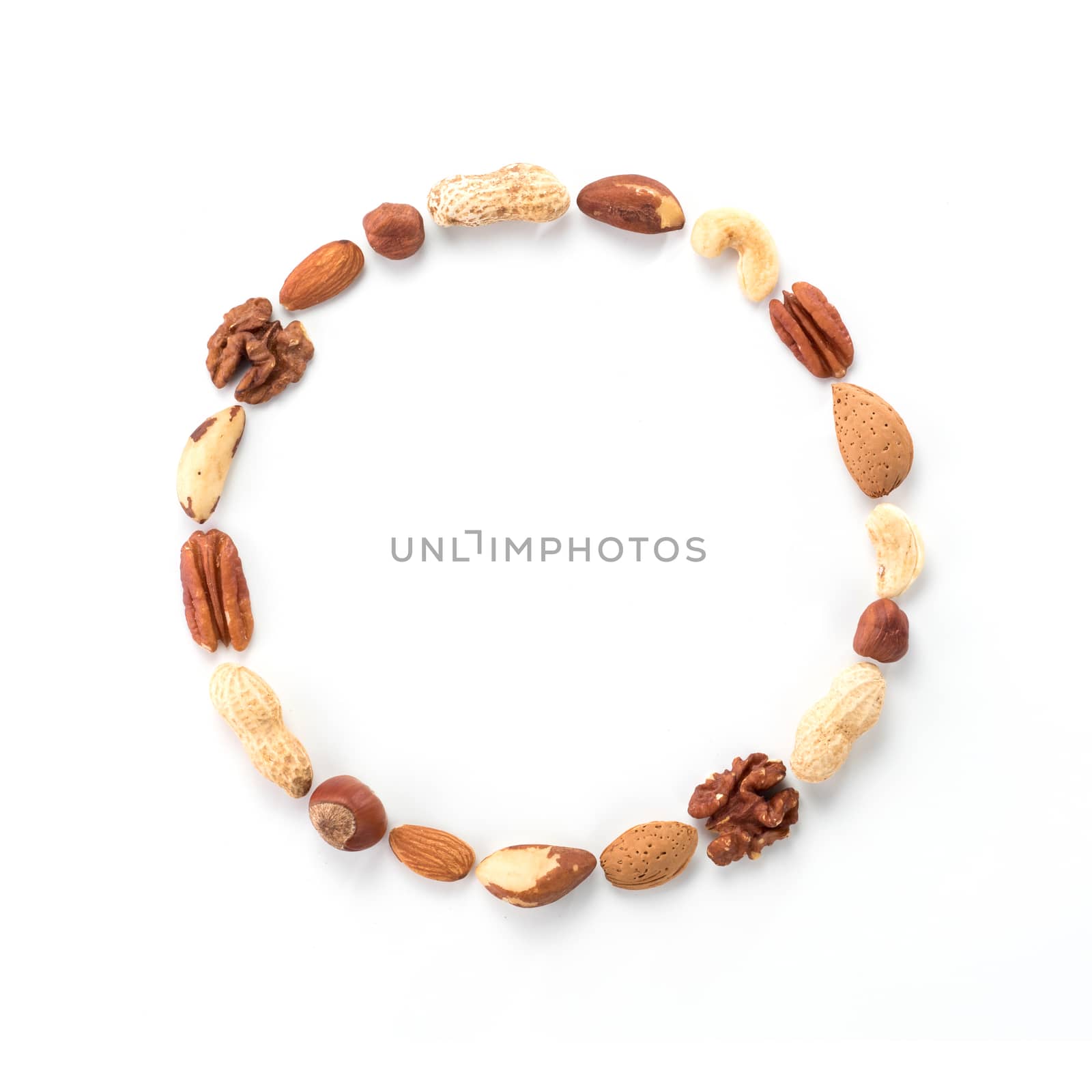 Pattern of nuts in circle form isolated on whie by fascinadora