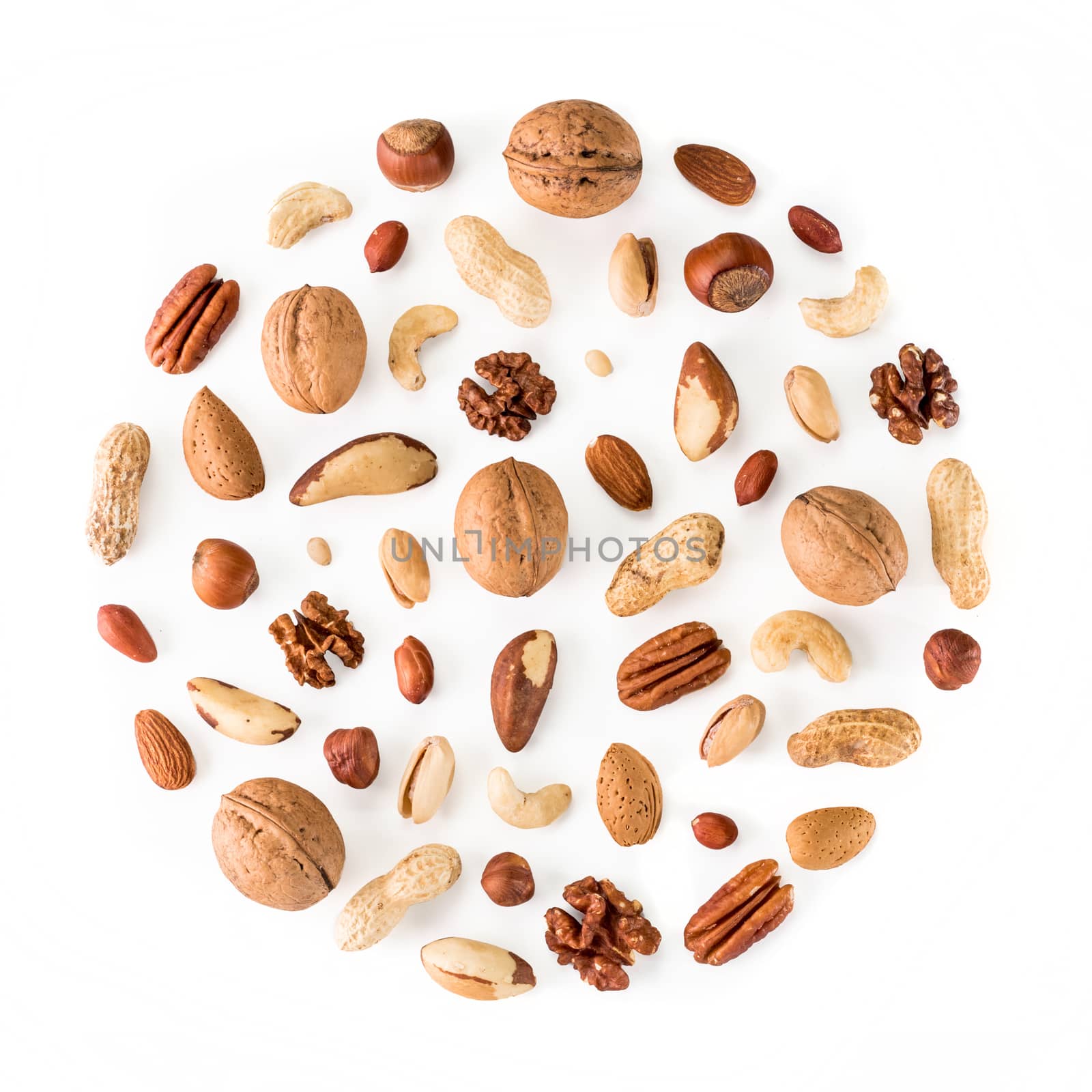 Pattern of nuts in circle form isolated on whie by fascinadora