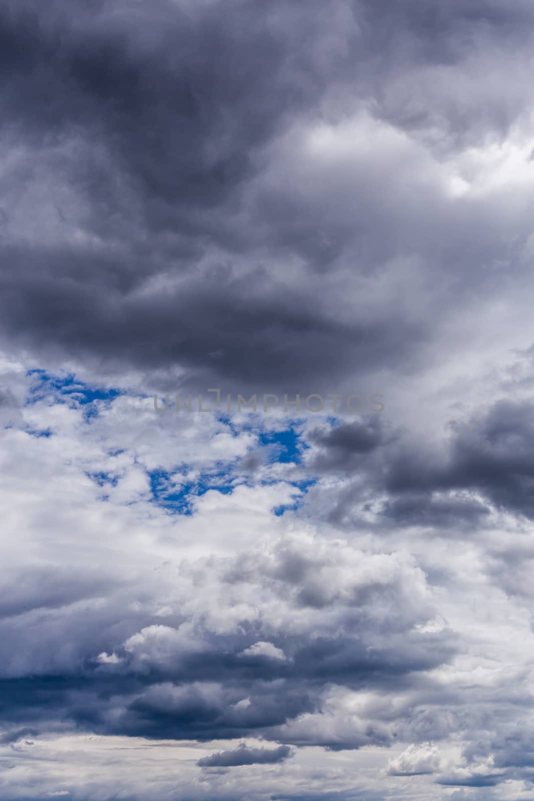 gray incoming storm clouds closeup backdrop, captured with telephoto lens