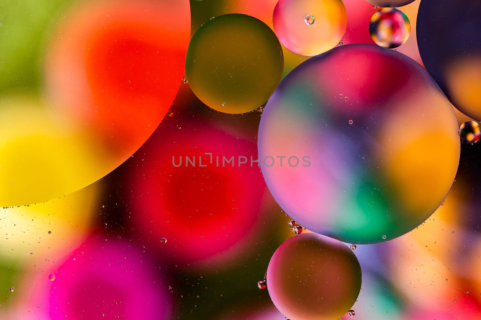 colorful surface with abstract round shapes structure of oil in water.