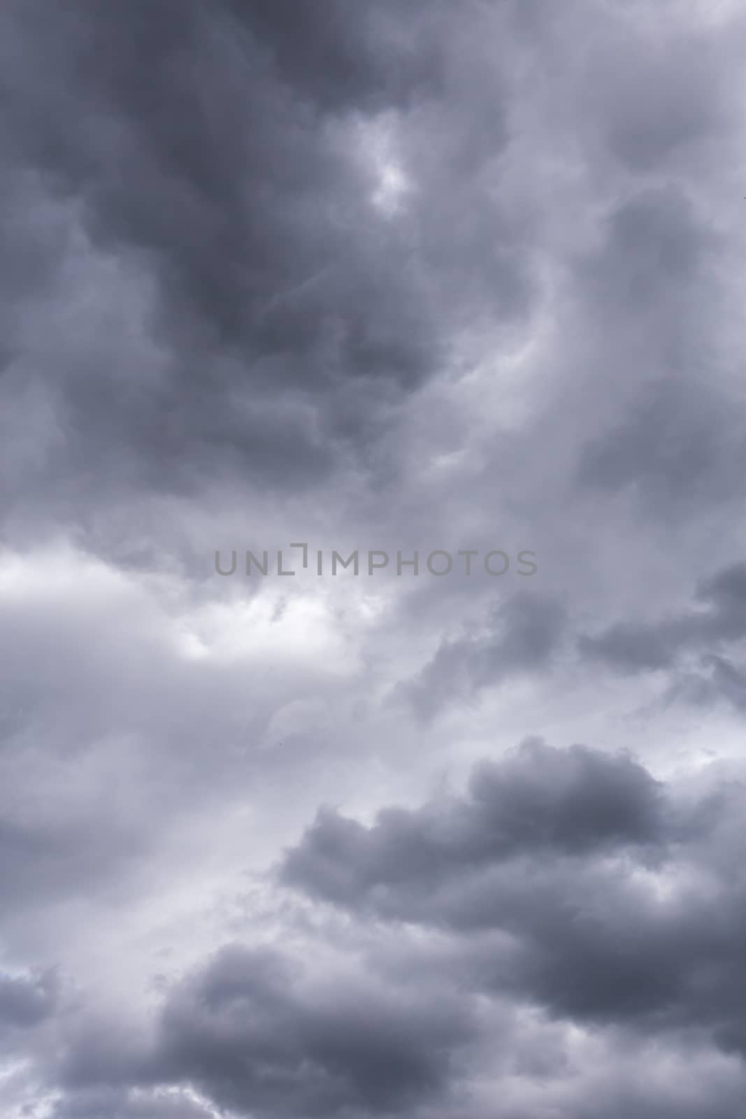 gray incoming storm clouds closeup backdrop, captured with telephoto lens