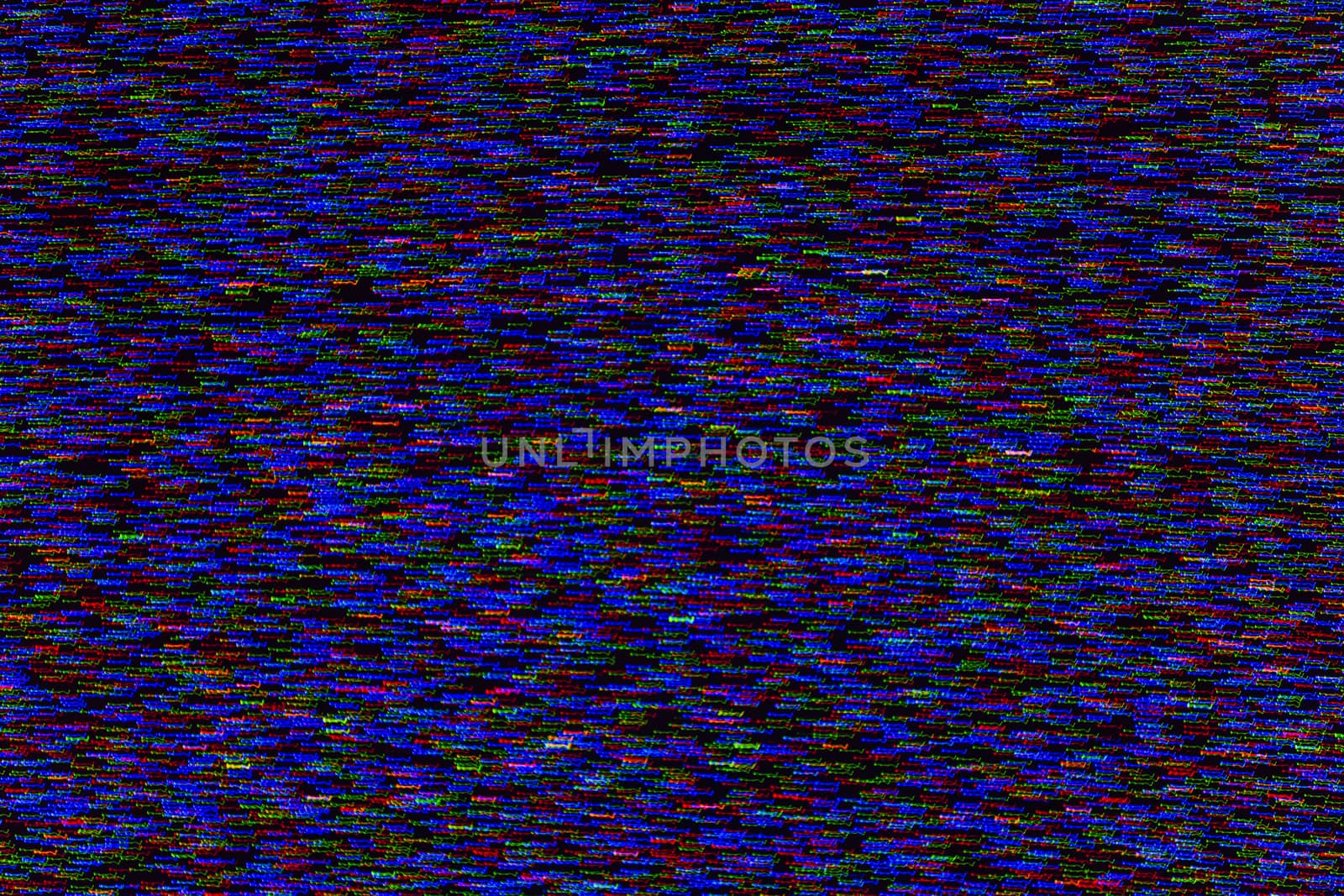 abstract random colored noise dots blurred by motion on black background.