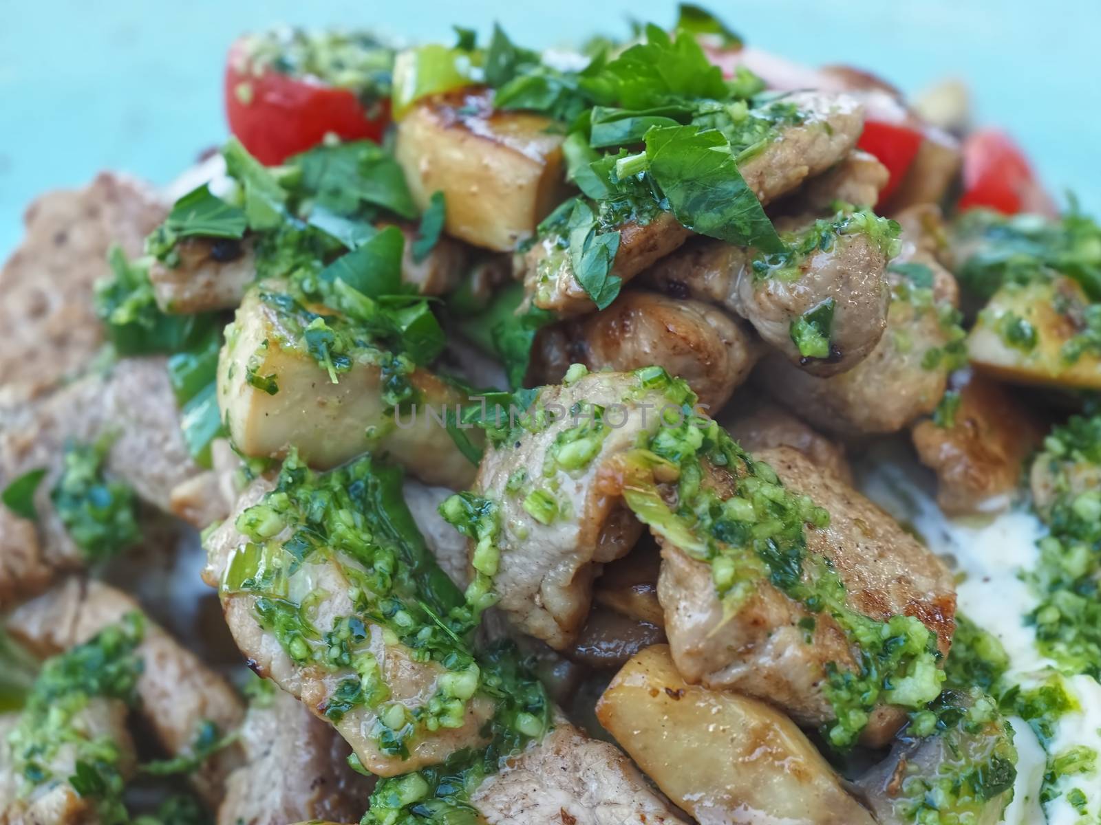 modern cooking with pork tenderloin, potatoes, sour creme and herbs