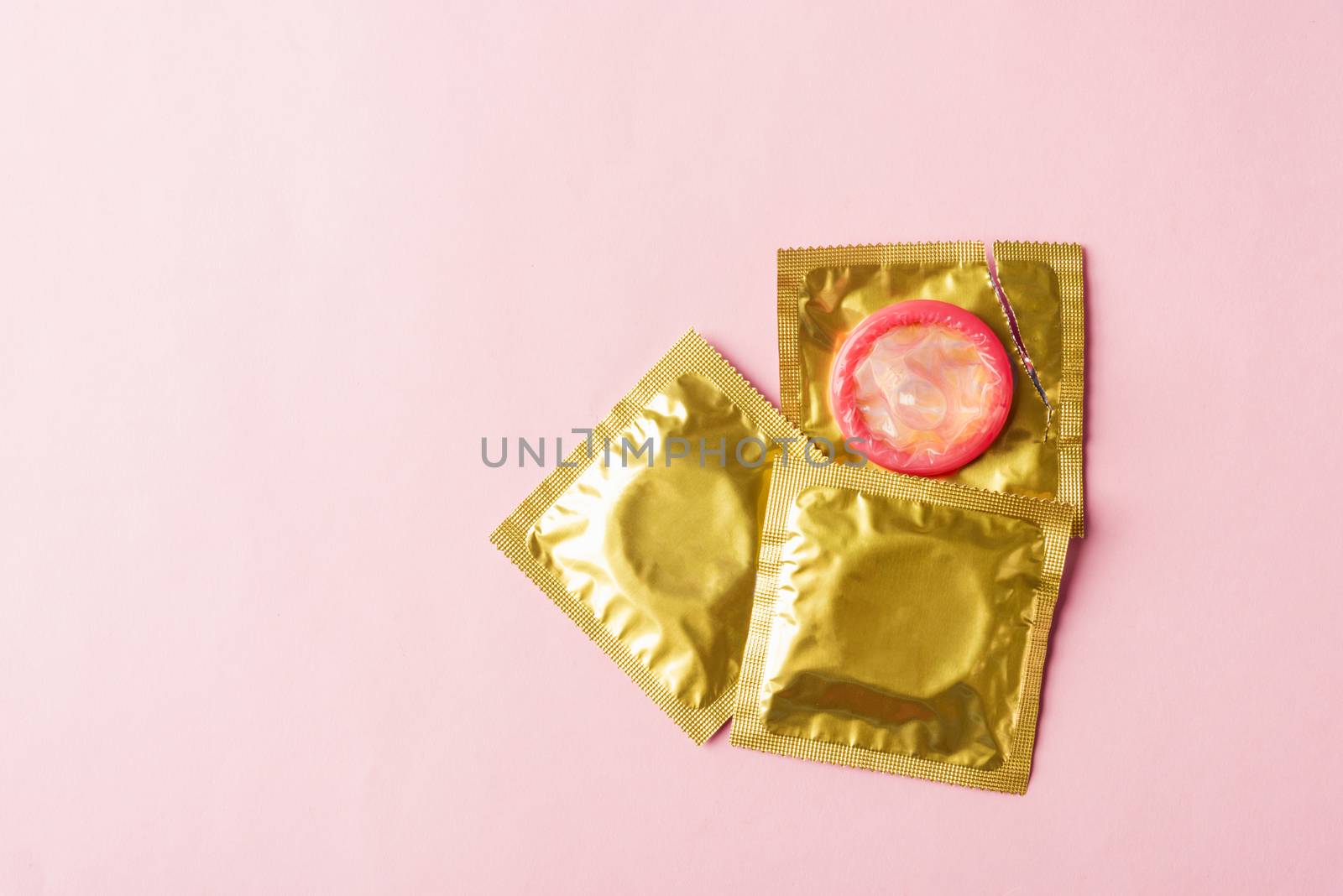 condom in wrapper pack is tear open by Sorapop