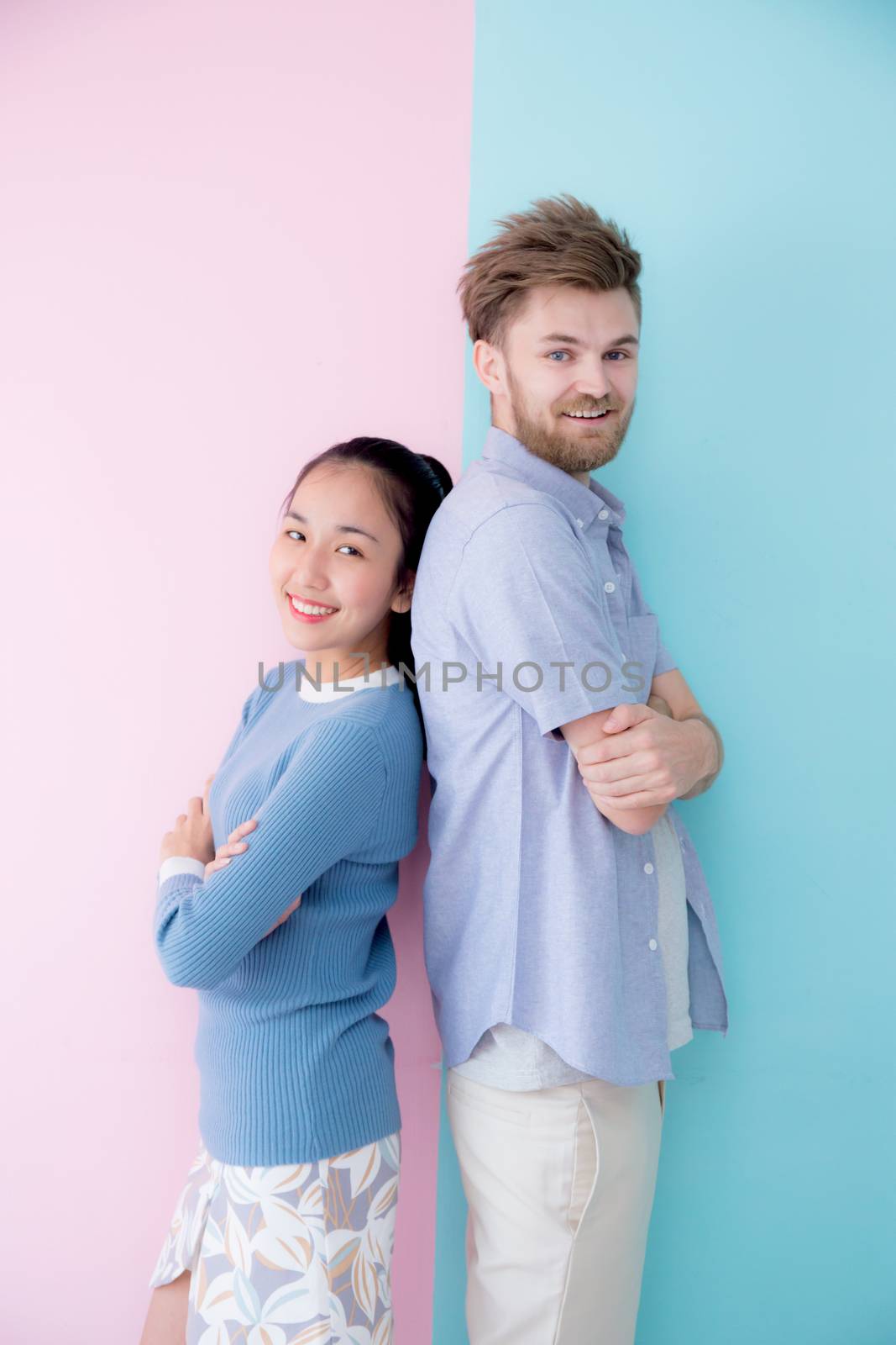 Portrait of a happy couple together standing retro color backgro by nnudoo