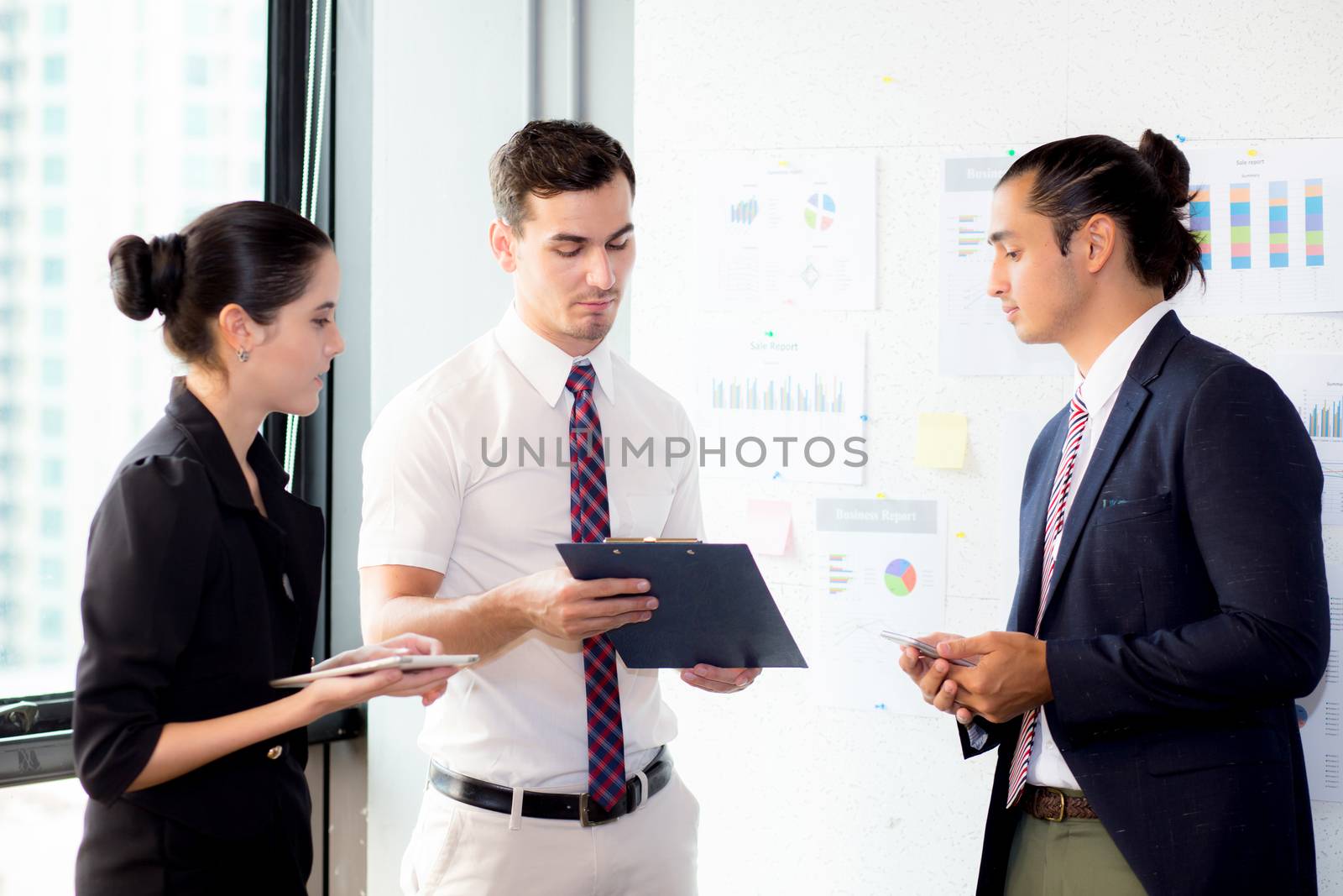 young businessman holding clipboard with present profit and secr by nnudoo
