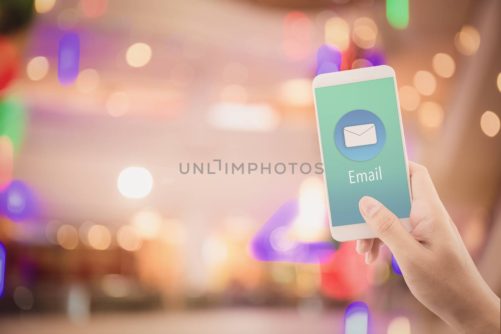 Hand holding man check and sending message with email in a phone on abstract bokeh background, communication concept.