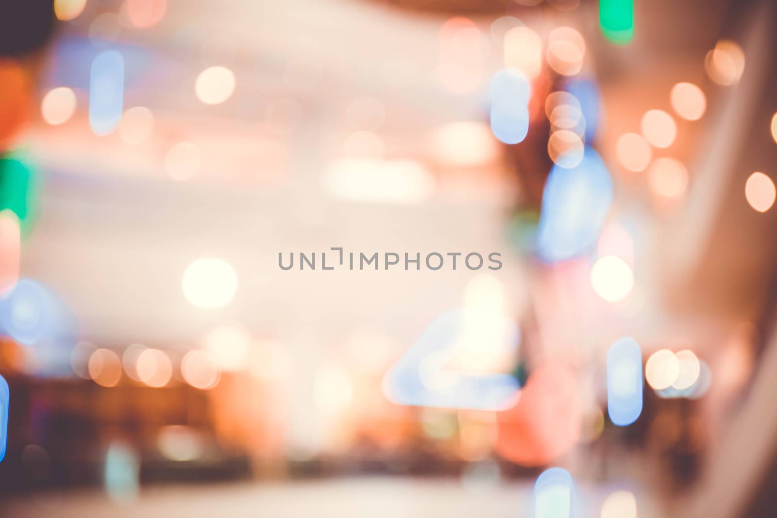 abstract blur bokeh light in department store colorful background concept.