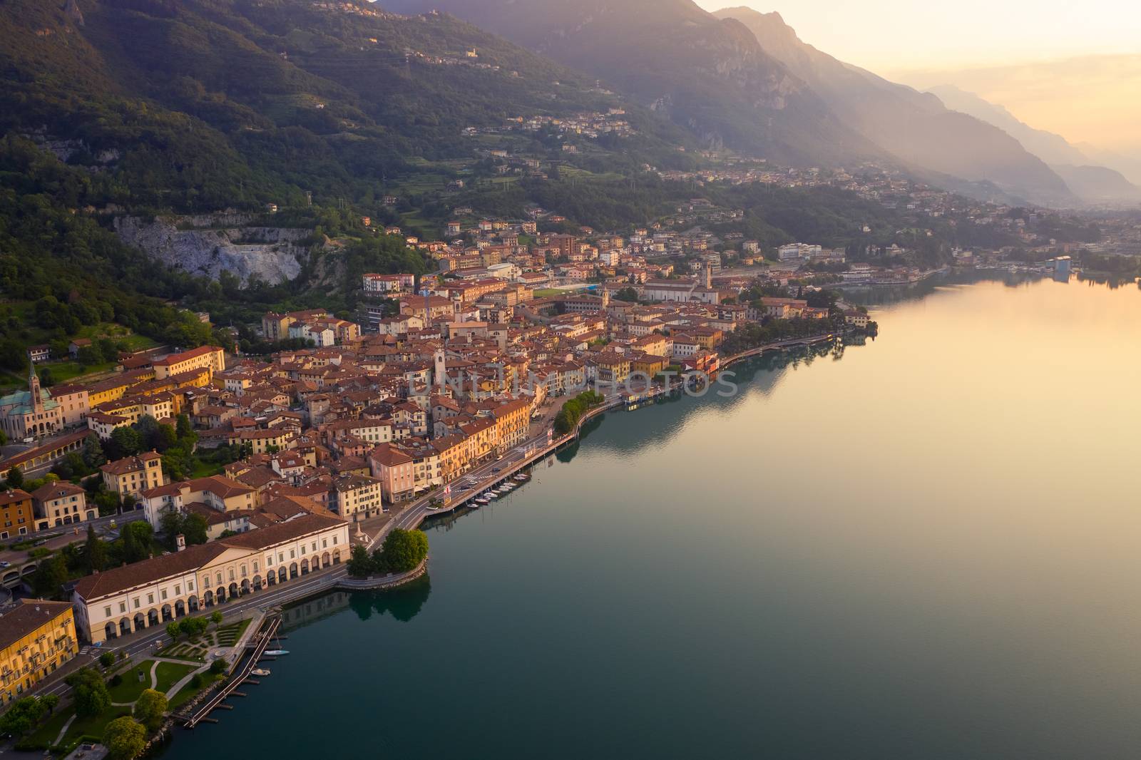 Aerial view of Lake Iseo at sunrise, on the left the city of lovere which runs along the lake,Bergamo Italy.