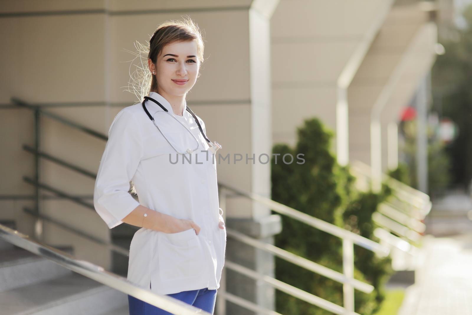 Portrait of a beautiful female doctor or nurse. Prevention Covid-19 healthcare concept. Stethoscope over the neck. Woman, girl.