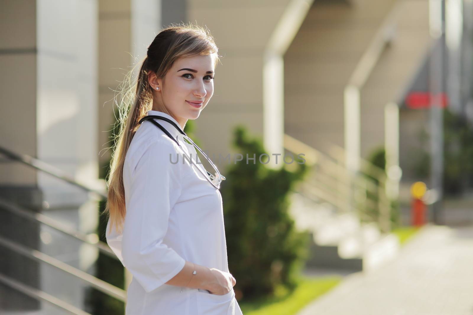 Portrait of a beautiful female doctor or nurse. Health concept. by selinsmo