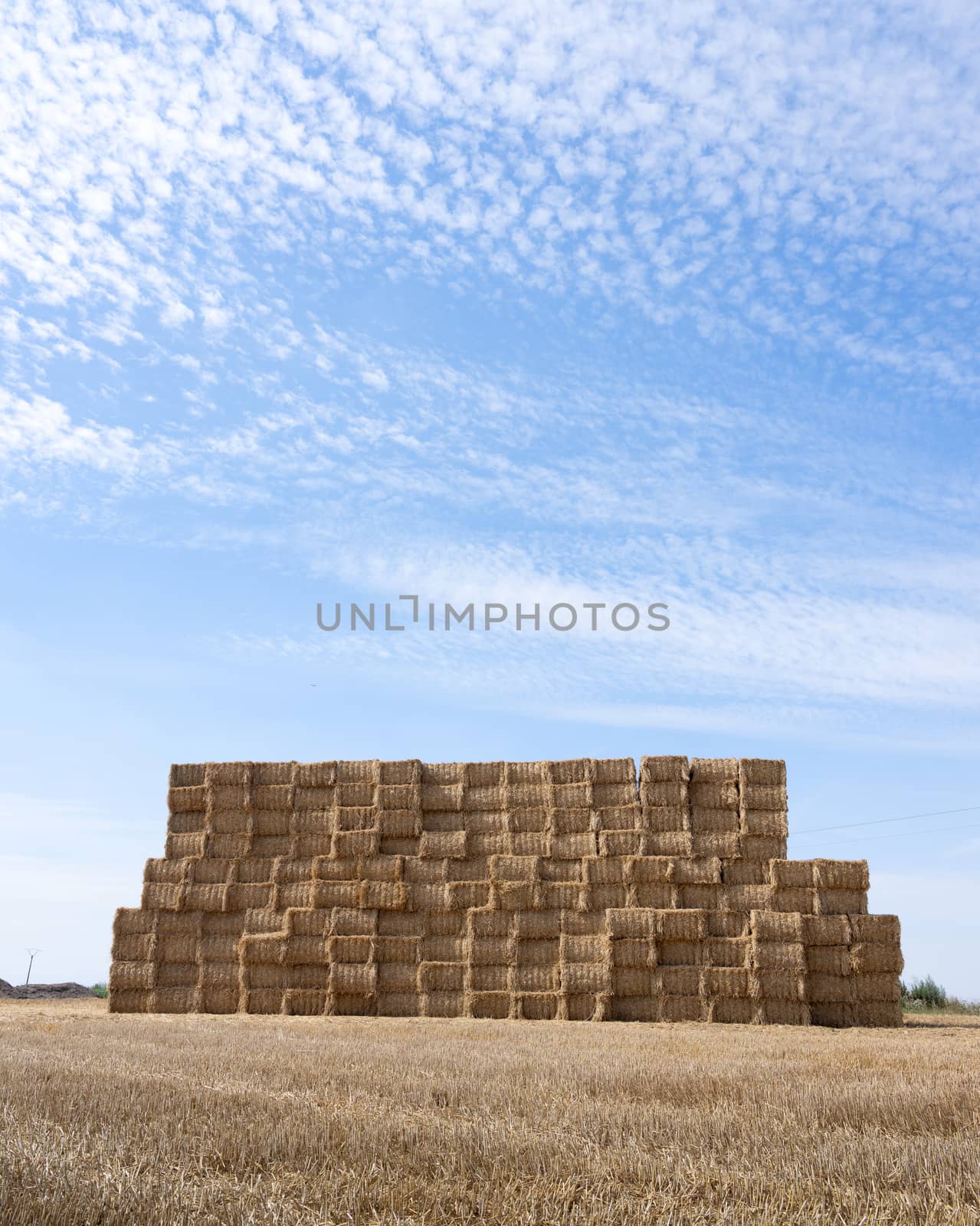 large piles of stacked straw bales in the noerth of france by ahavelaar