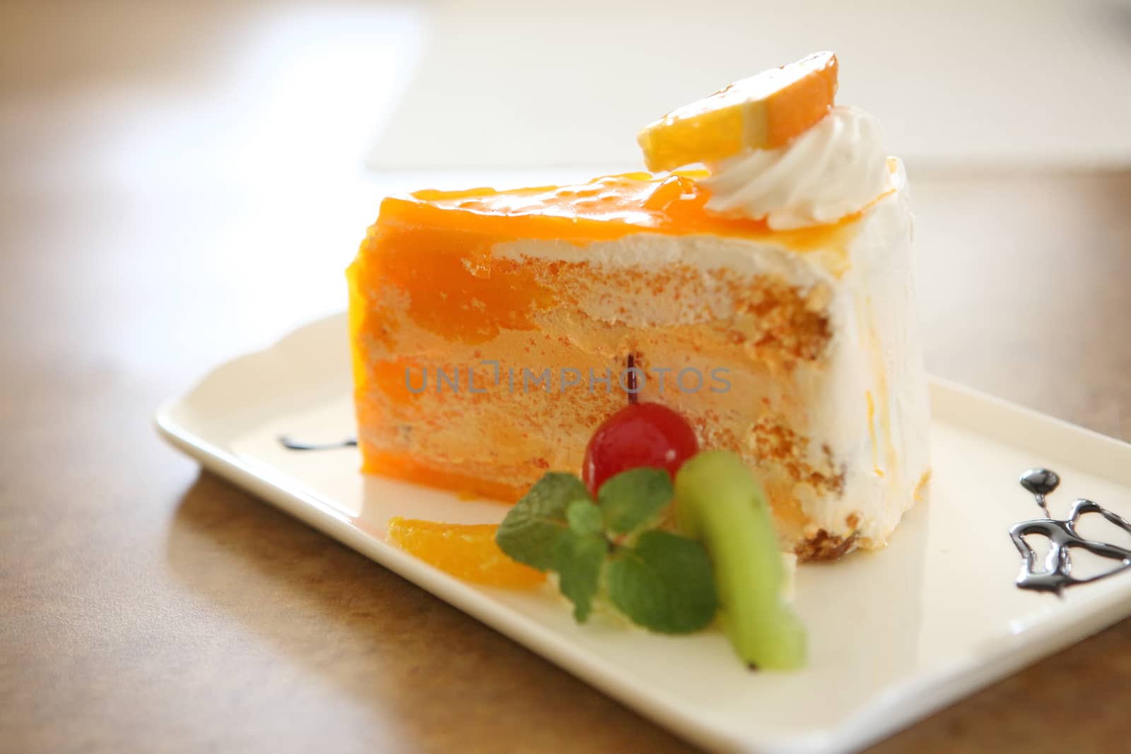 Orange cake on wood background