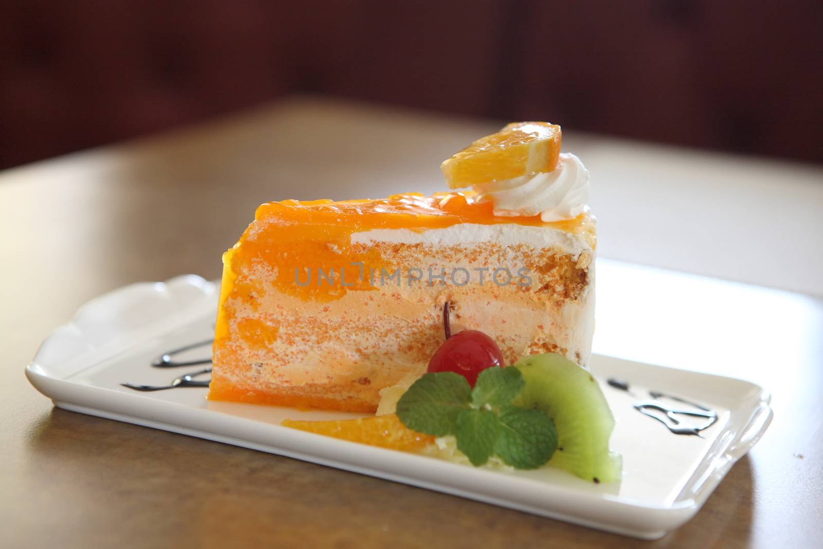 Orange cake on wood background