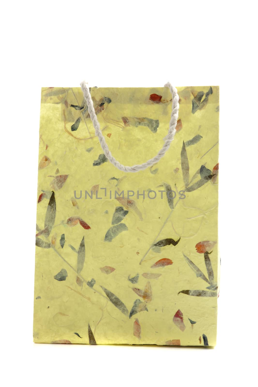 Yellow paper bag isolated in white background