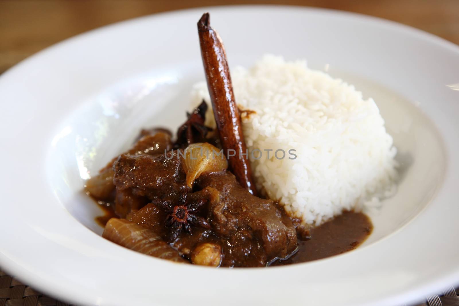 Beef curry with rice , Thai food on wood background