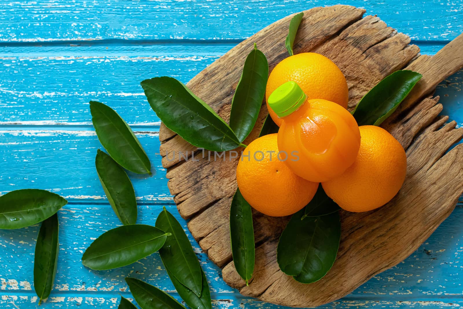 Fresh orange on a wooden table background.