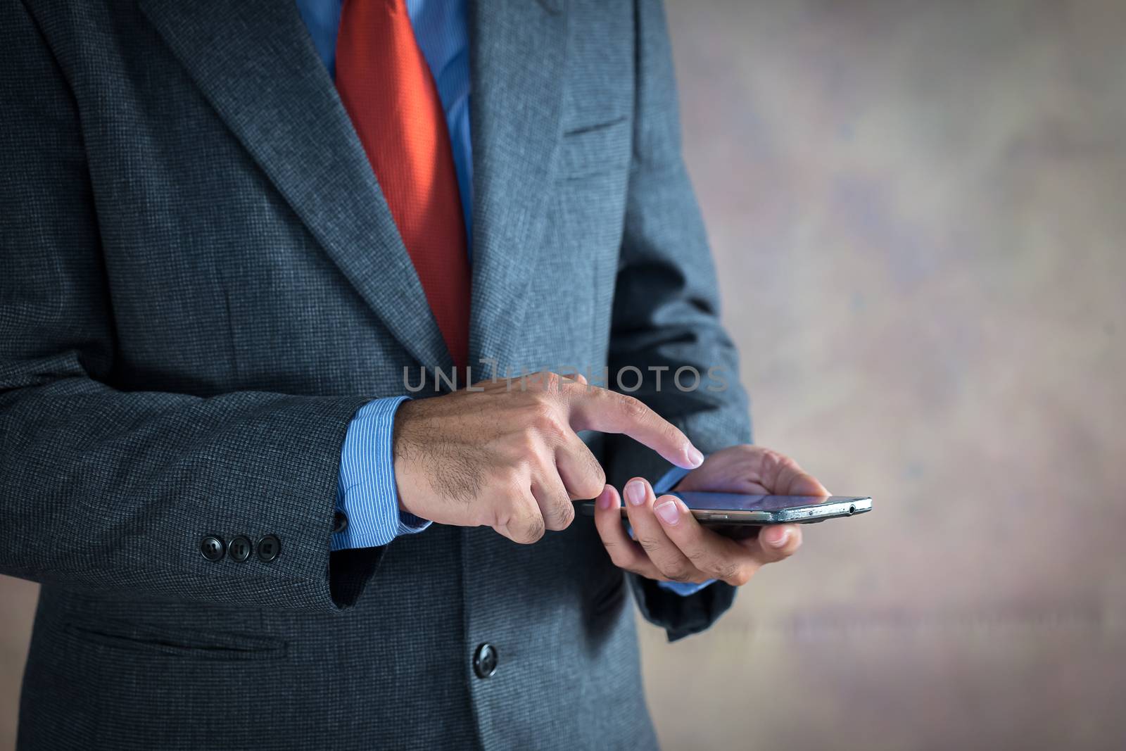 Businessman working on a virtual screen of the future. Businessmen are using mobile phones for transactions