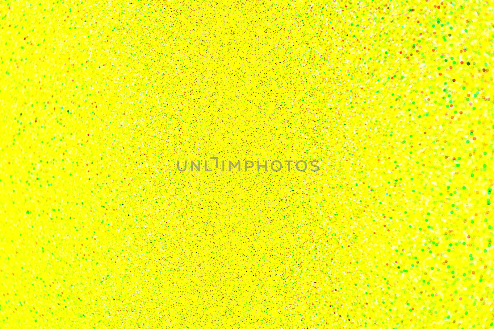 abstract natural small spots lens blur on yellow autogenic background with selective focus.