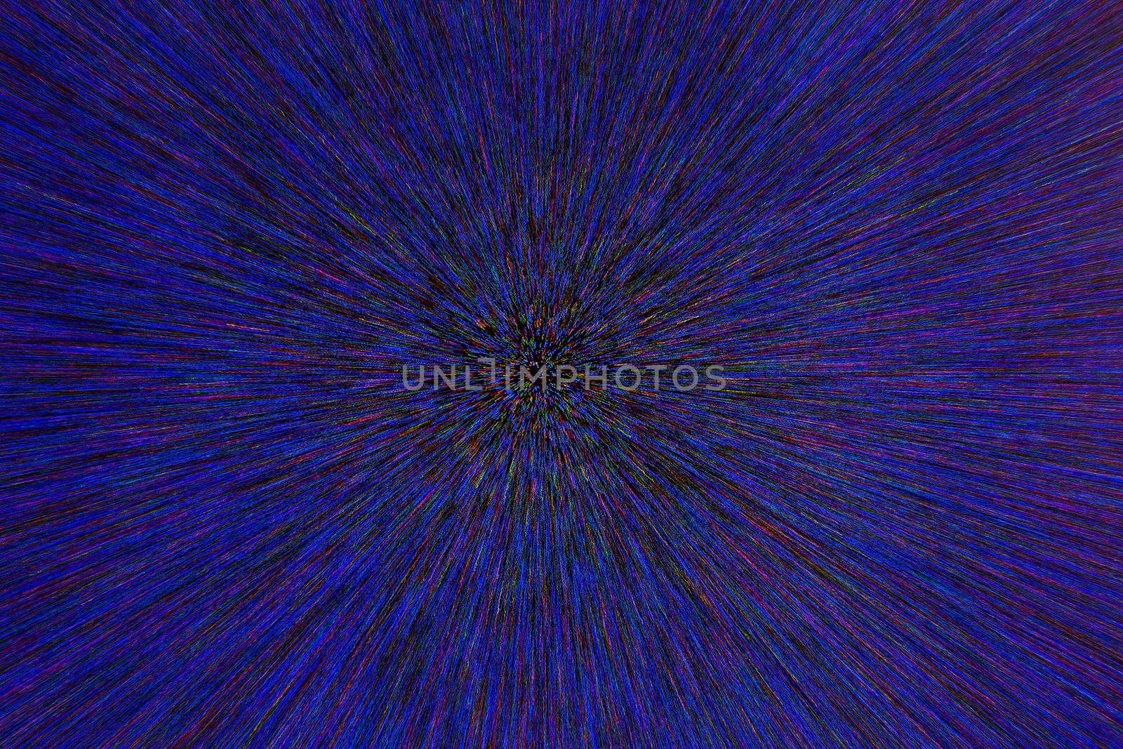 natural lens zoom explosion radial blurred red green blue dots on black background with selective focus.