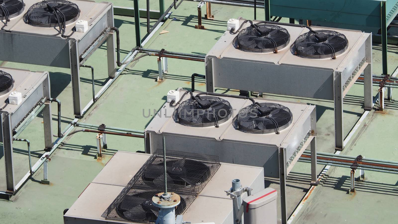 Old air conditioner Compressor on the terrace space and outdoor in summer daytime Bangkok Thailand and top view angle shot.