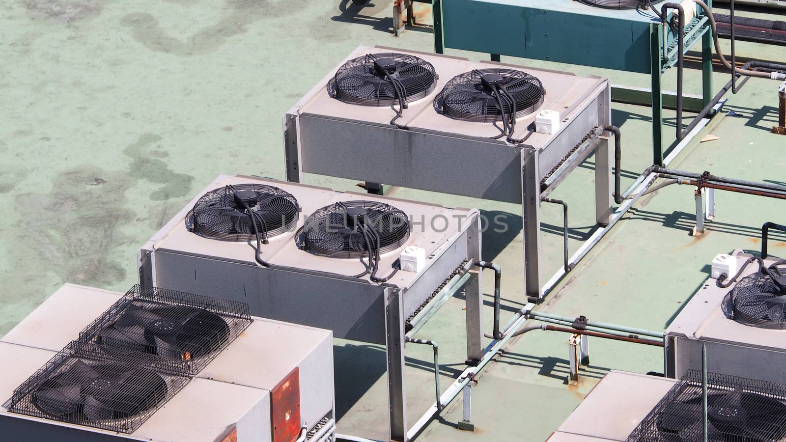 Old air conditioner Compressor on the terrace space and outdoor in summer daytime Bangkok Thailand and top view angle shot.