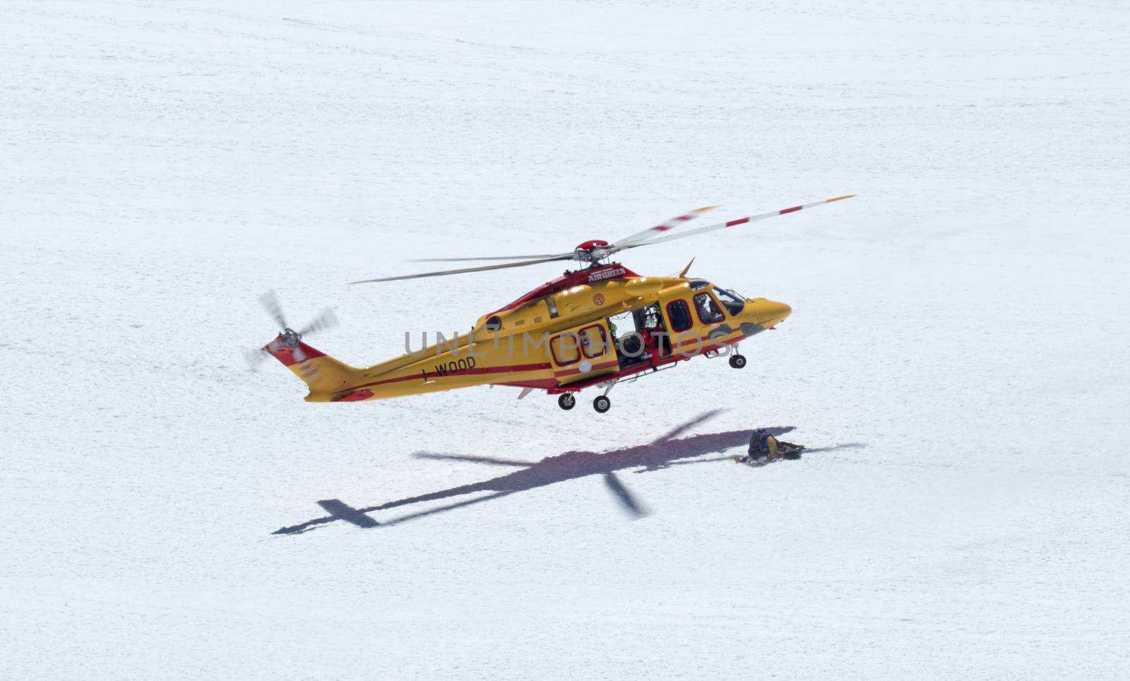 Yellow rescue helicopter near the Swiss Matterhorn