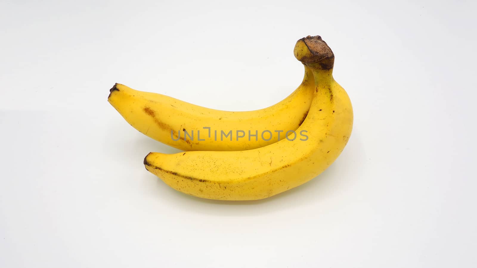 Real two yellow banana from Bangkok Thailand no retouch and white background studio shot and isolated.