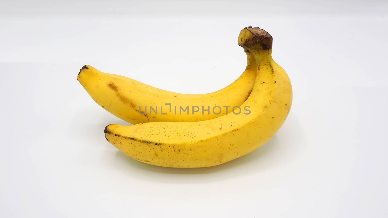 Real two yellow banana from Bangkok Thailand no retouch and white background studio shot and isolated.