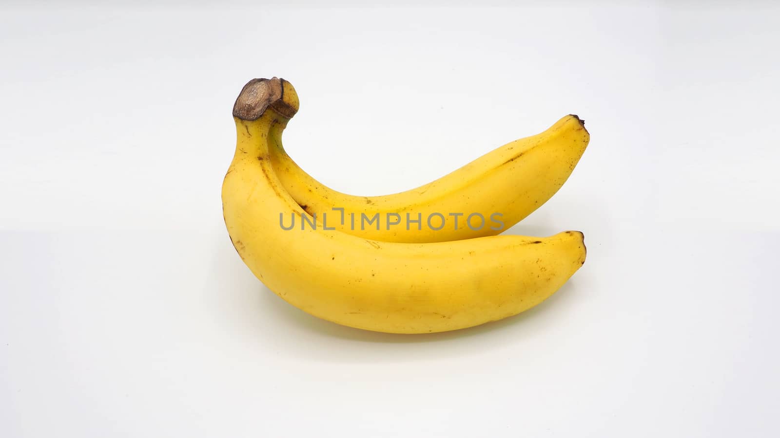 Real two yellow banana from Bangkok Thailand no retouch and white background studio shot and isolated.