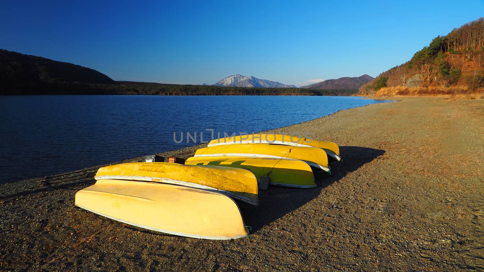 Yellow boats which made by old wood for fisherman by gnepphoto