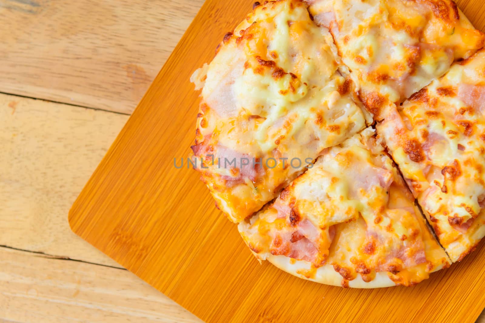 Home made pizza on wood plate