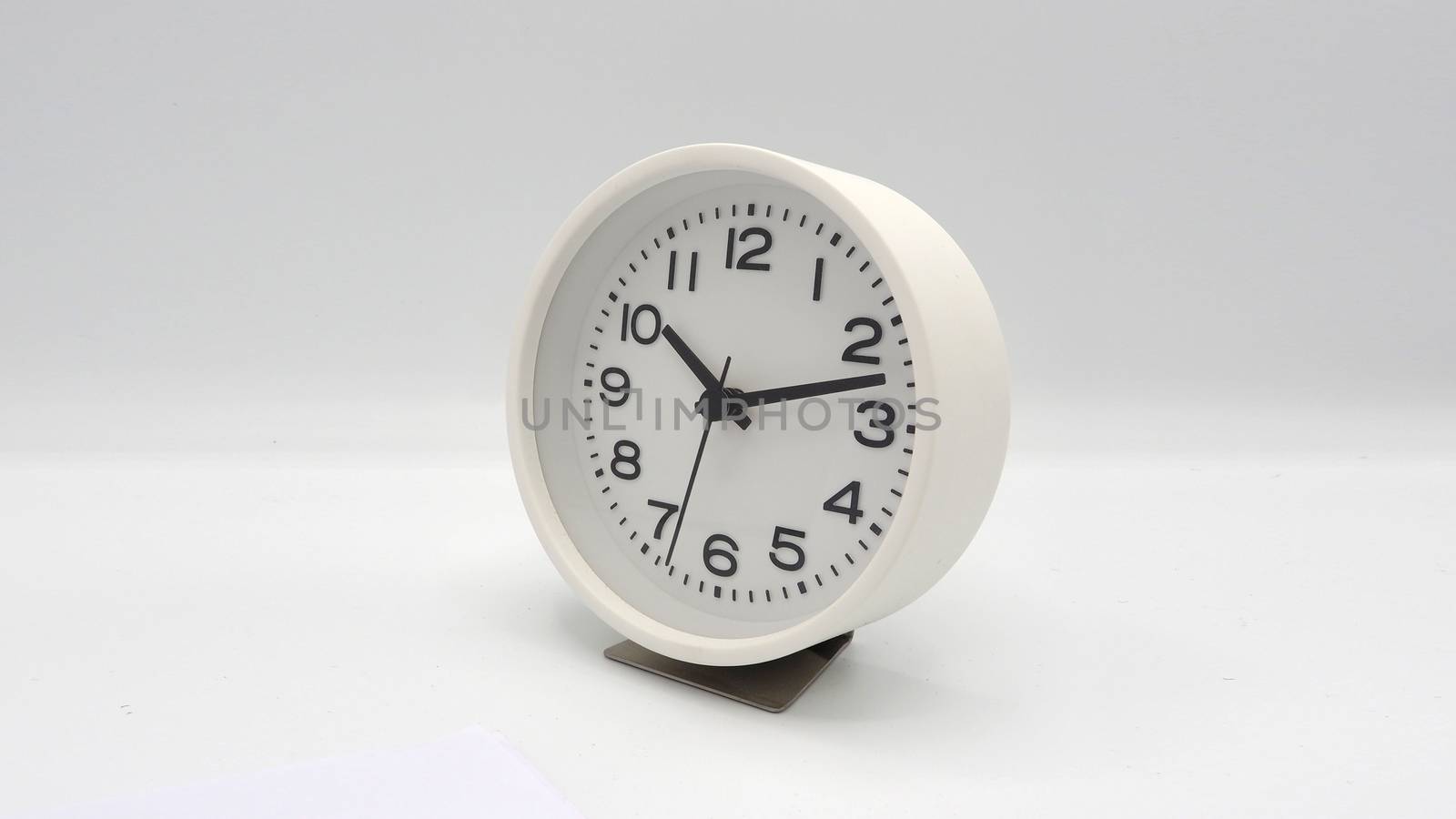 Modern and clean white color clock  by gnepphoto