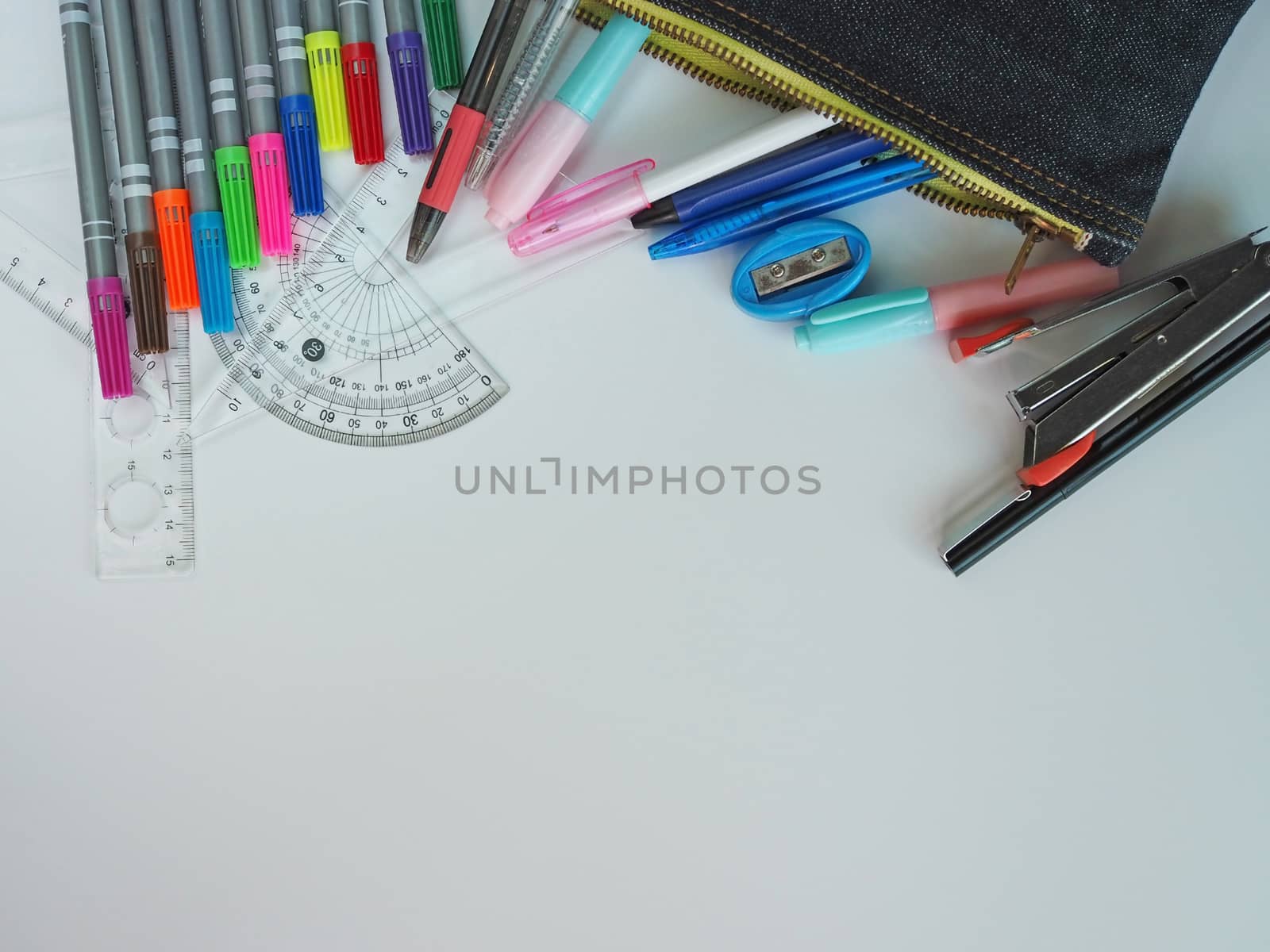 School supplies Placed on a white background in the top view pattern And have free space.