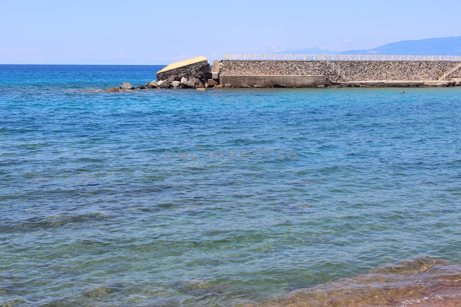 pier of marina of Pizzo damaged by winter storms. Force of the sea