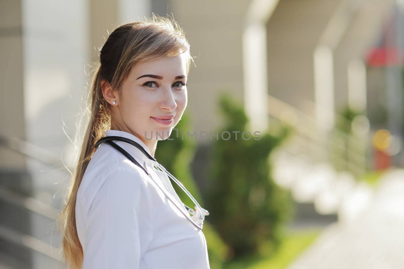 Portrait of a beautiful female doctor or nurse. Health concept. by selinsmo
