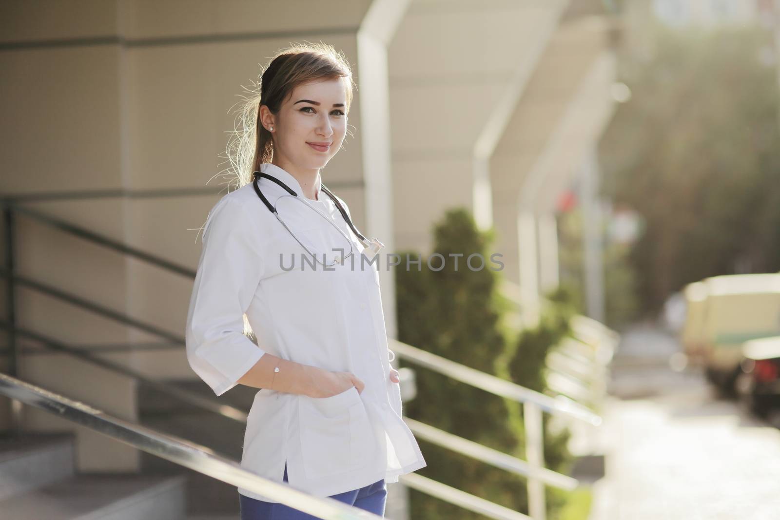 Portrait of a beautiful female doctor or nurse. Prevention Covid-19 healthcare concept. Stethoscope over the neck. Woman, girl.