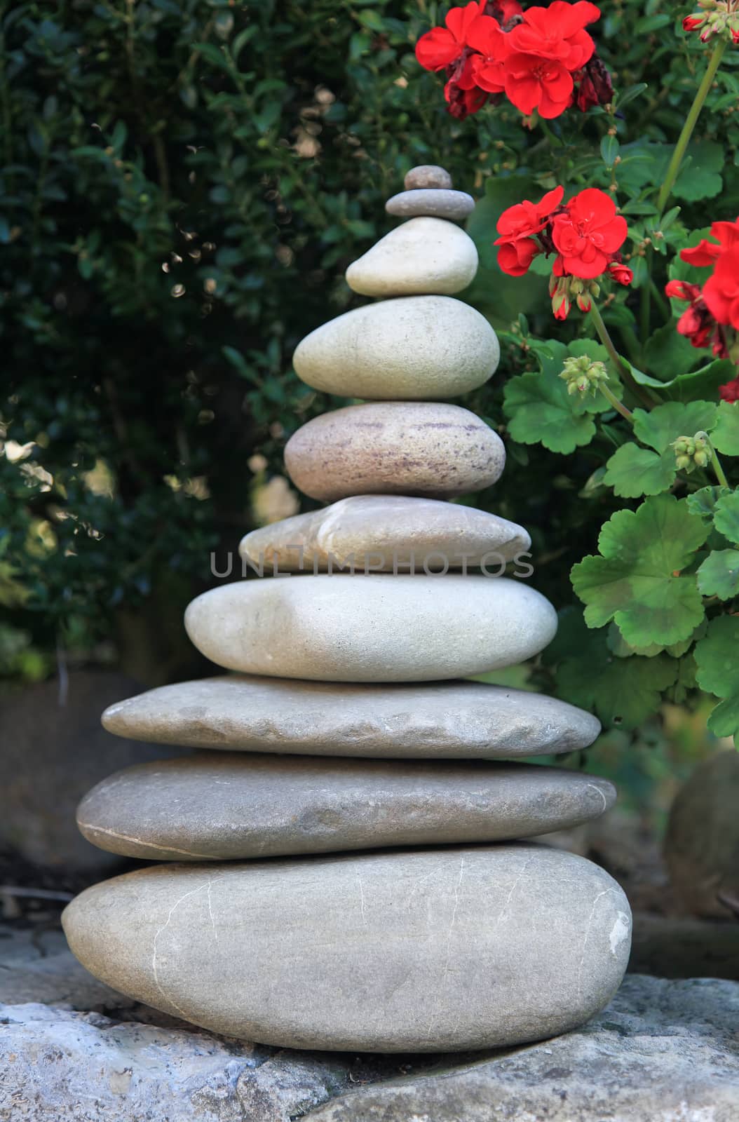 Stone pyramid and flowers