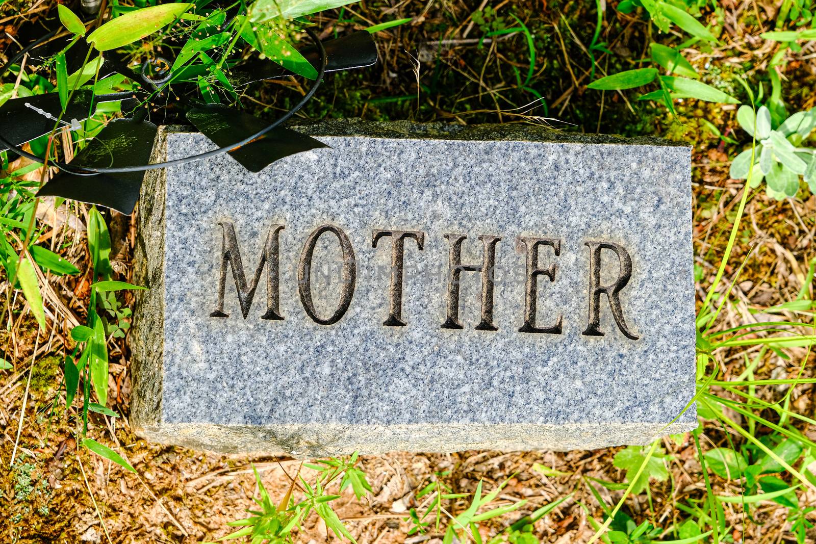Mother Engraved on a Granite Grave Marker in a Cemetery