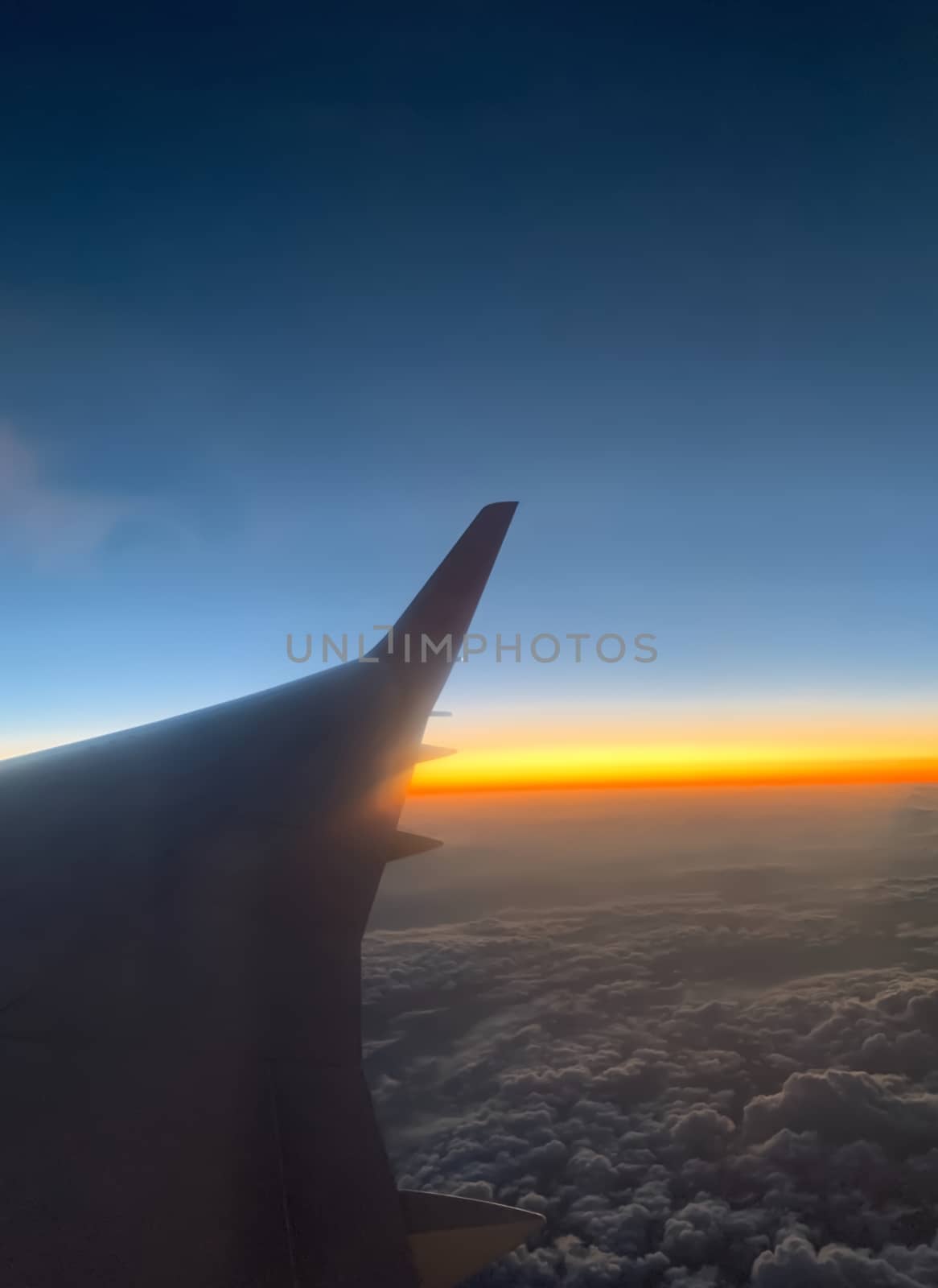 The atmosphere above the earth from 7 miles up. Looking out the window of a passenger plane, there is a sky that the atmosphere of the sun. Up in the morning.