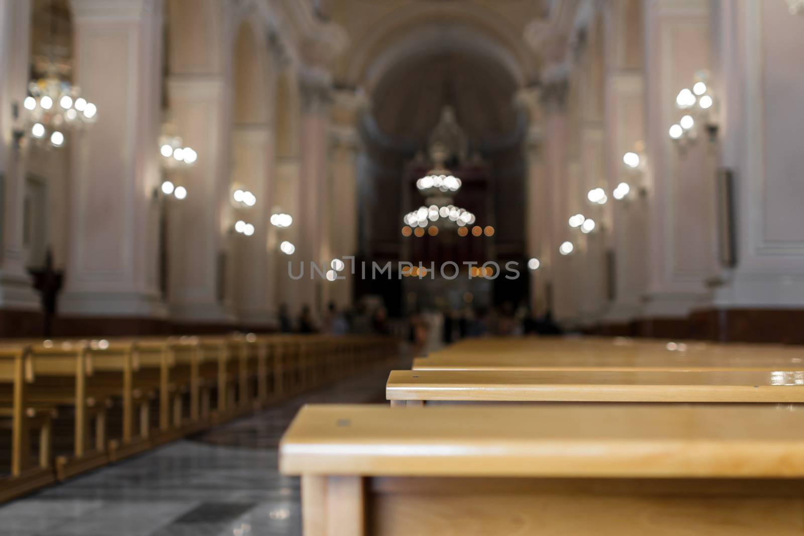 An italian church with focus on the detail of a bench.